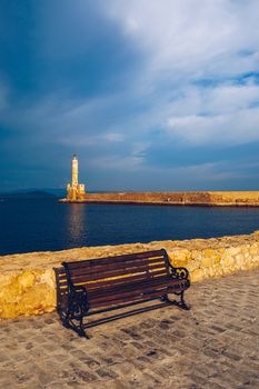 Panorama of venetian harbour waterfront and lighthouse in old harbour of Chania, Crete, Greece. Old venetian lighthouse in Chania, Greece. Lighthouse of the old Venetian port in Chania, Greece.