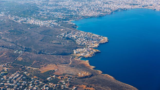 Crete island. Beautiful view of the Crete island Greece from the plane. Holiday, relaxation, sea. Crete view from plane. Greek Island. Seaside of Crete island, aerial view, Greece.
