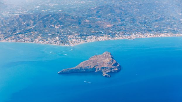 Crete island. Beautiful view of the Crete island Greece from the plane. Holiday, relaxation, sea. Crete view from plane. Greek Island. Seaside of Crete island, aerial view, Greece.
