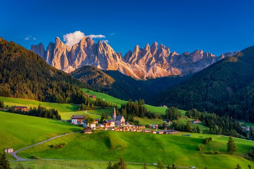 Santa Maddalena (Santa Magdalena) village with magical Dolomites mountains in background, Val di Funes valley, Trentino Alto Adige region, South Tyrol, Italy, Europe. Santa Maddalena Village, Italy. 