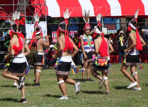 KAOHSIUNG, TAIWAN -- SEPTEMBER 29, 2018: Members of the indigenous Amis tribe in traditional costumes participate in the yearly harvest festival.