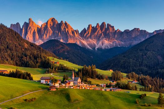 Santa Maddalena (Santa Magdalena) village with magical Dolomites mountains in background, Val di Funes valley, Trentino Alto Adige region, South Tyrol, Italy, Europe. Santa Maddalena Village, Italy. 