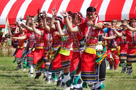 KAOHSIUNG, TAIWAN -- SEPTEMBER 29, 2018: Members of the indigenous Amis tribe in traditional costumes participate in the yearly harvest festival.