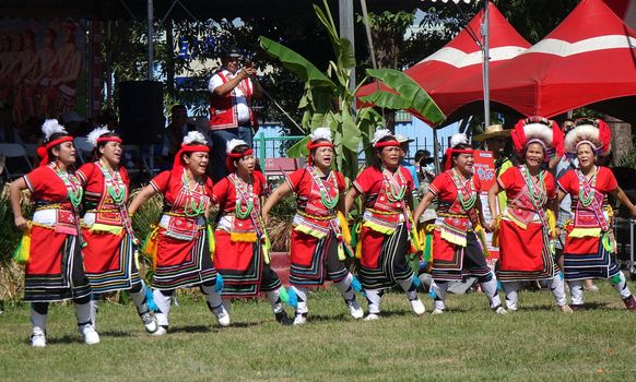 KAOHSIUNG, TAIWAN -- SEPTEMBER 29, 2018: Members of the indigenous Amis tribe in traditional costumes participate in the yearly harvest festival.
