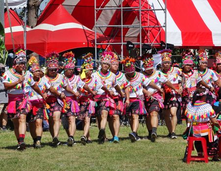 KAOHSIUNG, TAIWAN -- SEPTEMBER 29, 2018: Members of the indigenous Amis tribe in traditional costumes participate in the yearly harvest festival.