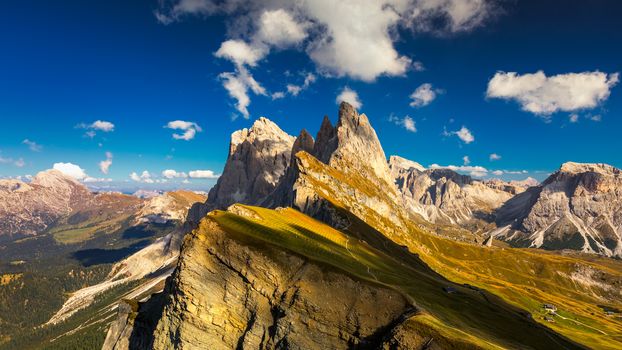 View on Seceda peak. Trentino Alto Adige, Dolomites Alps, South Tyrol, Italy. Odle mountain range, Val Gardena. Majestic Furchetta peak. Odles group seen from Seceda, Santa Cristina Val Gardena.