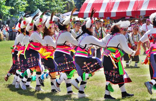 KAOHSIUNG, TAIWAN -- SEPTEMBER 29, 2018: Members of the indigenous Amis tribe in traditional costumes participate in the yearly harvest festival.