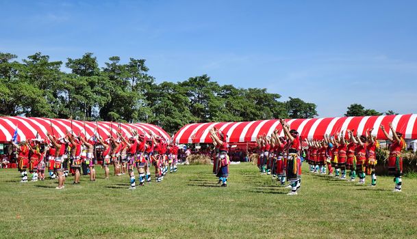 KAOHSIUNG, TAIWAN -- SEPTEMBER 29, 2018: Members of the indigenous Amis tribe in traditional costumes participate in the yearly harvest festival.