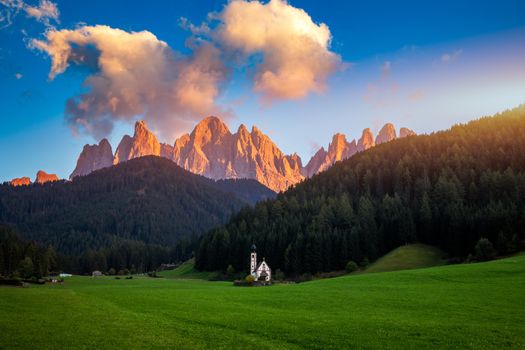 Beautiful landscape with Italian Alps and Church of Saint John located in Ranui, Italy. Val di Funes, Bolzano, Italy. San Giovanni in Ranui church (St John in Ranui church) in the Dolomites, Italy.