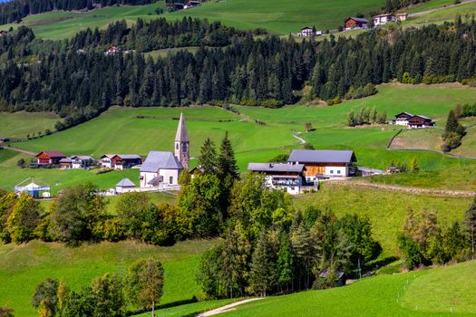 Santa Maddalena (Santa Magdalena) village with magical Dolomites mountains in background, Val di Funes valley, Trentino Alto Adige region, South Tyrol, Italy, Europe. Santa Maddalena Village, Italy. 