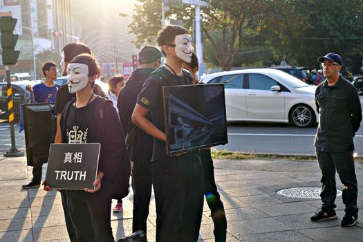 KAOHSIUNG, TAIWAN -- DECEMBER 14, 2019: Demonstrators at a busy intersection in downtown protest against cruelty in the livestock industry.
