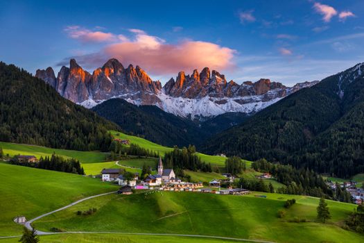 Santa Maddalena (Santa Magdalena) village with magical Dolomites mountains in background, Val di Funes valley, Trentino Alto Adige region, South Tyrol, Italy, Europe. Santa Maddalena Village, Italy. 