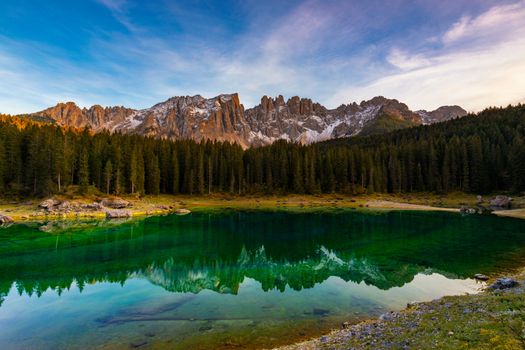 Carezza lake (Lago di Carezza, Karersee) with Mount Latemar, Bolzano province, South tyrol, Italy. Landscape of Lake Carezza or Karersee and Dolomites in background, Nova Levante, Bolzano, Italy.