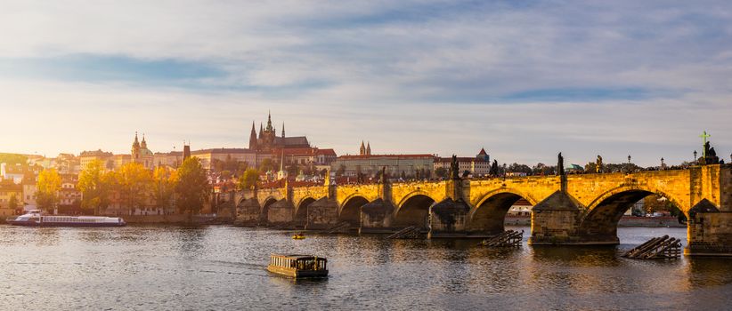 Charles Bridge in Prague in Czechia. Prague, Czech Republic. Charles Bridge (Karluv Most) and Old Town Tower. Vltava River and Charles Bridge. Concept of world travel, sightseeing and tourism.