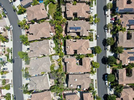 Aerial view of upper middle class neighborhood with residential houses in green valley, South California, USA.