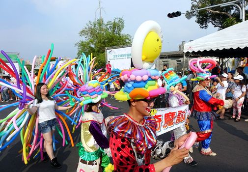 KAOHSIUNG, TAIWAN -- OCTOBER 1, 2017: Balloon artists take part in a street parade at the opening of the 2017 Ecomobility Festival.
