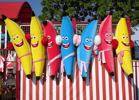 KAOHSIUNG, TAIWAN -- JANUARY 11, 2020: A skill game at a local amusement park offers large pillows in the shape of bananas as prizes.
