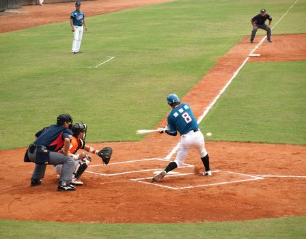 PINGTUNG, TAIWAN, APRIL 8: Batter Zhan of the Lamigo Monkeys hits the ball in a Pro Baseball game against the President Lions. The Lions won 2:0 on April 8, 2012 in Pingtung.


