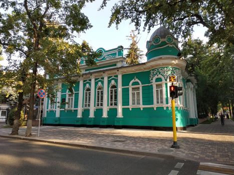 Almaty, Kazakhstan - August 28, 2019: Old merchant's house with stucco floral ornaments, was built in the early 20th century by order of Titus Golovizin - Verny master shoemakers.