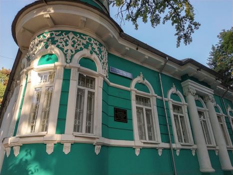Almaty, Kazakhstan - August 28, 2019: Old merchant's house with stucco floral ornaments, was built in the early 20th century by order of Titus Golovizin - Verny master shoemakers.