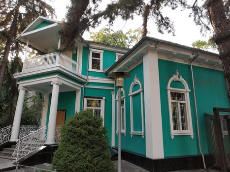 Almaty, Kazakhstan - August 28, 2019: Old merchant's house with stucco floral ornaments, was built in the early 20th century by order of Titus Golovizin - Verny master shoemakers.