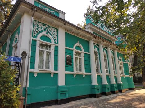 Almaty, Kazakhstan - August 28, 2019: Old merchant's house with stucco floral ornaments, was built in the early 20th century by order of Titus Golovizin - Verny master shoemakers.