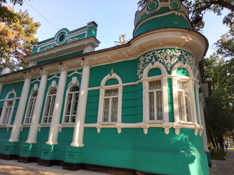 Almaty, Kazakhstan - August 28, 2019: Old merchant's house with stucco floral ornaments, was built in the early 20th century by order of Titus Golovizin - Verny master shoemakers.