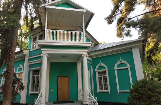 Almaty, Kazakhstan - August 28, 2019: Old merchant's house with stucco floral ornaments, was built in the early 20th century by order of Titus Golovizin - Verny master shoemakers.