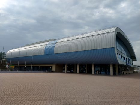 Almaty, Kazakhstan - August 14, 2019: Sports and training complex with a large swimming pool, football field and basketball court. Located at the intersection of Abay and Rozybakiev streets.