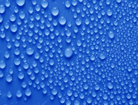 Water drops texture on blue background