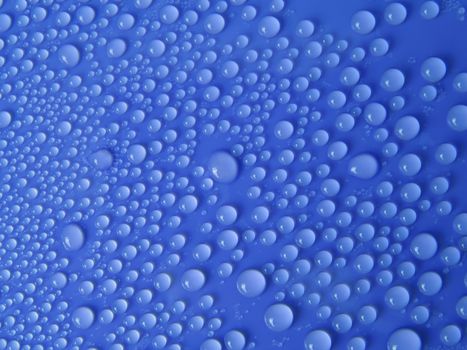 Water drops texture on blue background
