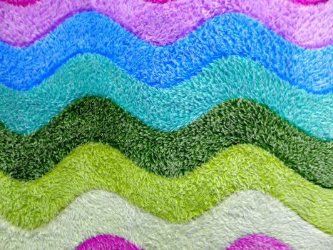 Colorful background of bath mat closeup