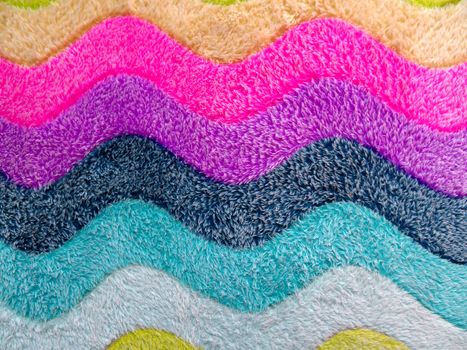Colorful background of bath mat closeup