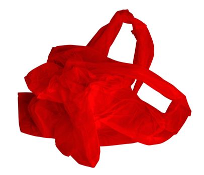 Red crumpled plastic bag isolated on white. Photo with clipping path.