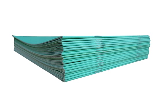 Stack of blue notebooks isolated on a white. Clipping path included.