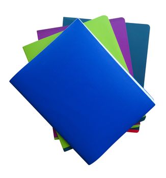 Stack of colorful notebooks isolated on a white. Clipping path included.