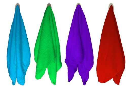 Colorful towels hanging on hooks isolated on white background. Clipping Path included.
