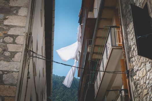 bielsa, spain - August 21, 2018: typical house architecture detail of this town where people walk on a summer day