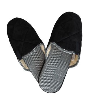 Woolen black slippers isolated on white background. Clipping Path included.
