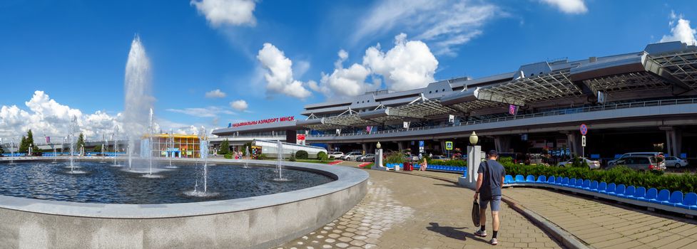 Minsk, Belarus - July 14, 2018: Wide angle view of National Airport. It is the main international airport in Belarus. Some people are walking near airport.