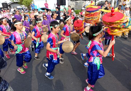 KAOHSIUNG, TAIWAN -- OCTOBER 1, 2017: A children percussion group performs at the opening of the 2017 Ecomobility Festival. 