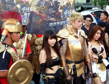 KAOHSIUNG, TAIWAN -- JUNE 17, 2015: Actors dressed up in fantasy costumes promote the mobile app strategy game Clash of Kings at a public event.