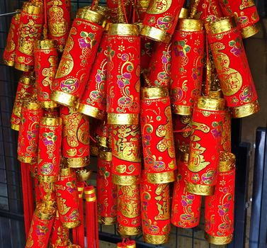 KAOHSIUNG, TAIWAN -- FEBRUARY 16, 2018: An outdoor stall sells colorful decorations for the Chinese New Year. Firecrackers are a symbol for good luck and prosperity.