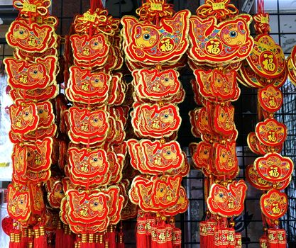 KAOHSIUNG, TAIWAN -- FEBRUARY 16, 2018: An outdoor stall sells colorful decorations for the Chinese New Year. The fish is a symbol for good luck and prosperity.
