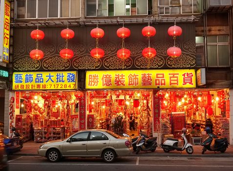 KAOHSIUNG, TAIWAN -- JANUARY 22, 2015: A large store sells colorful decorations, lanterns, lucky charms, paper cuts and printed couplets and proverbs for the Chinese New Year.