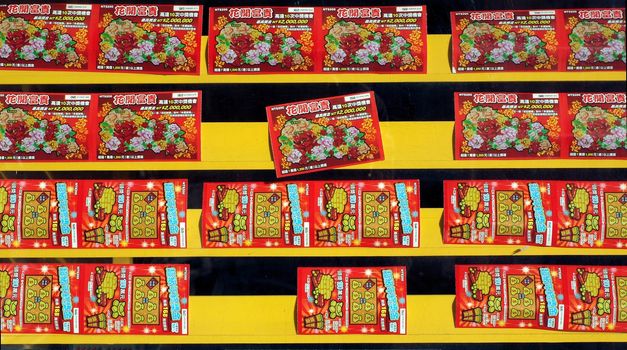 KAOHSIUNG, TAIWAN - JANUARY 22: With Chinese New Year approaching many Chinese like to gamble. This story is selling special New Year's lottery tickets on January 22, 2013 in Kaohsiung.