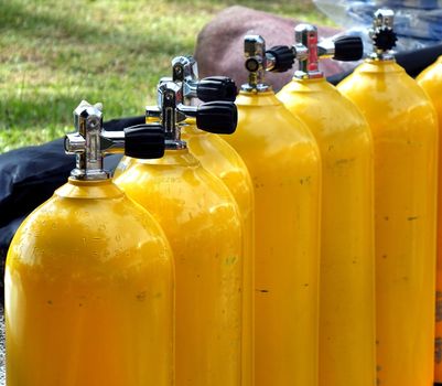 KAOHSIUNG, TAIWAN -- JUNE 30, 2018: Steel bottles with compressed air are prepared to inflate rubber boats at the 2018 Love River Festival.
