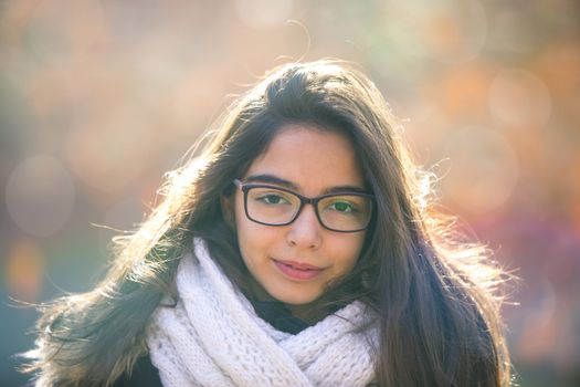 Beautiful girl in the park, bokeh in the background.