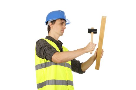 Worker man using the hammer with a plank.