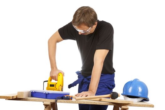 Man working with tools and wood. Over white.